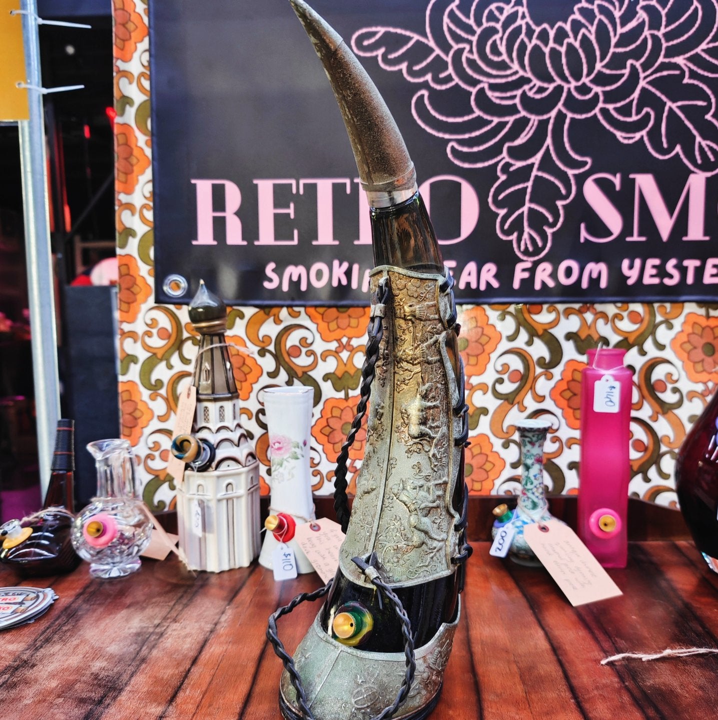 very old viking copper, green glass, and leather horn bong