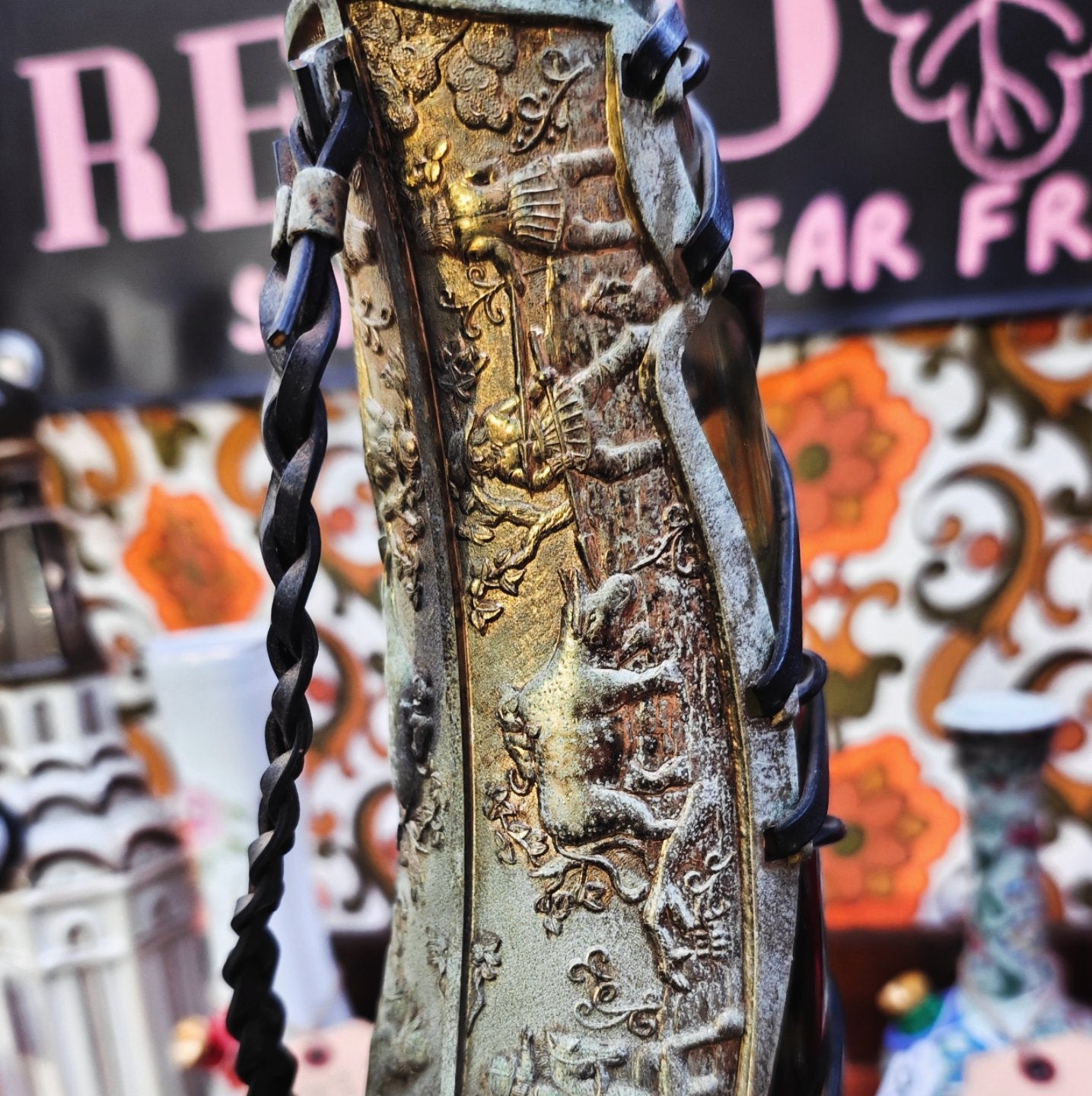 very old viking copper, green glass, and leather horn bong