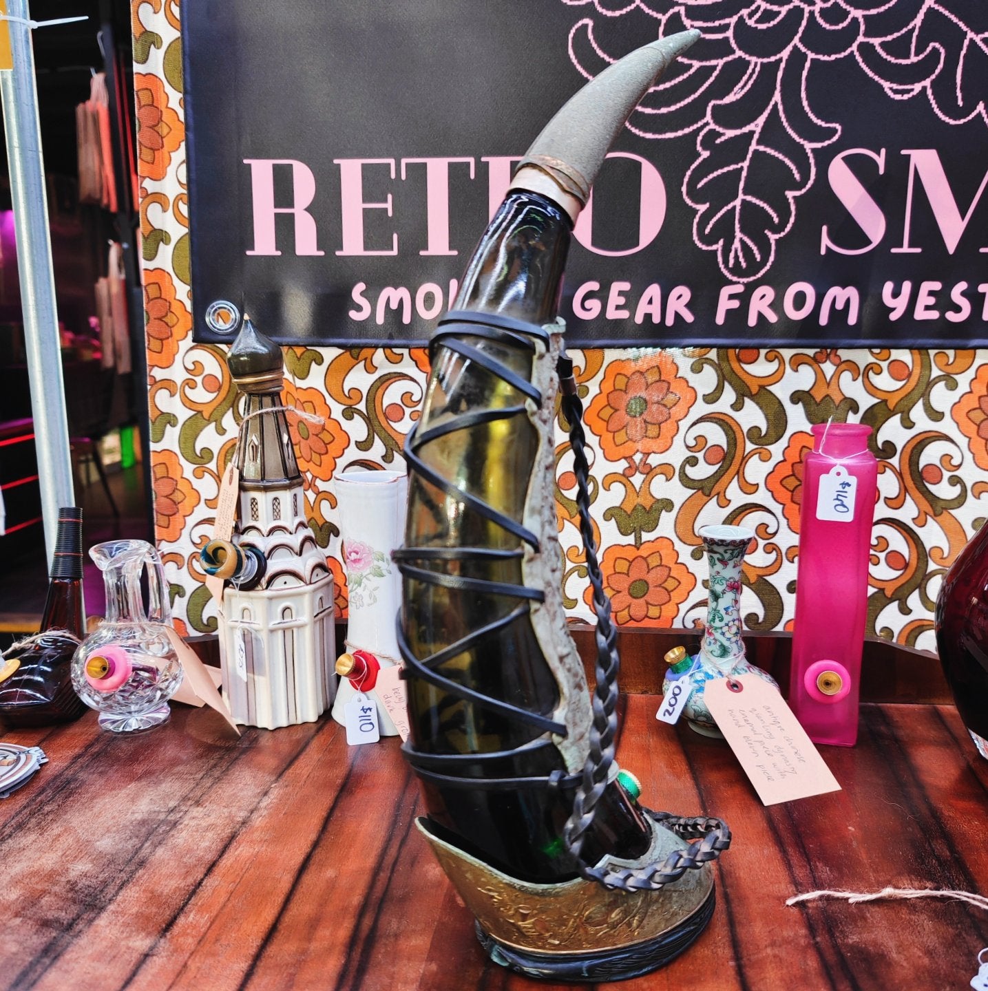 very old viking copper, green glass, and leather horn bong