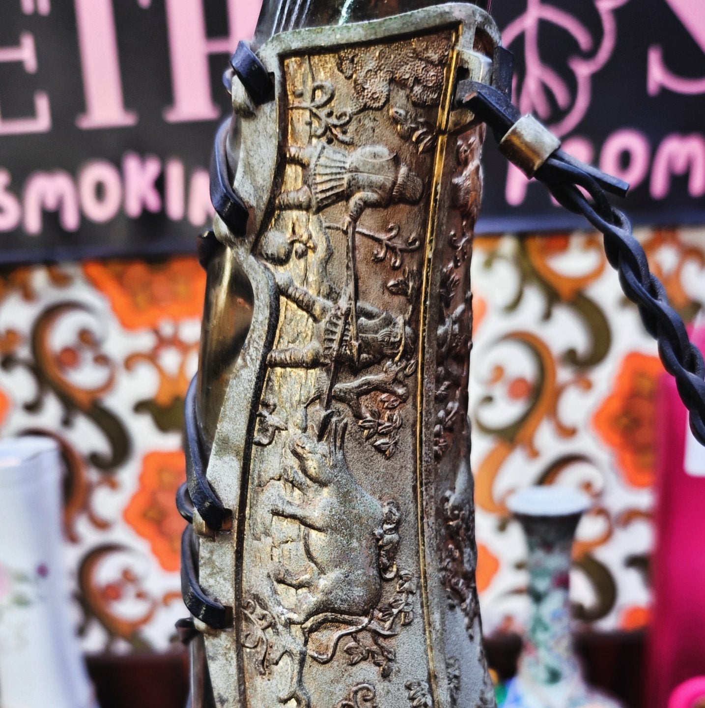 very old viking copper, green glass, and leather horn bong